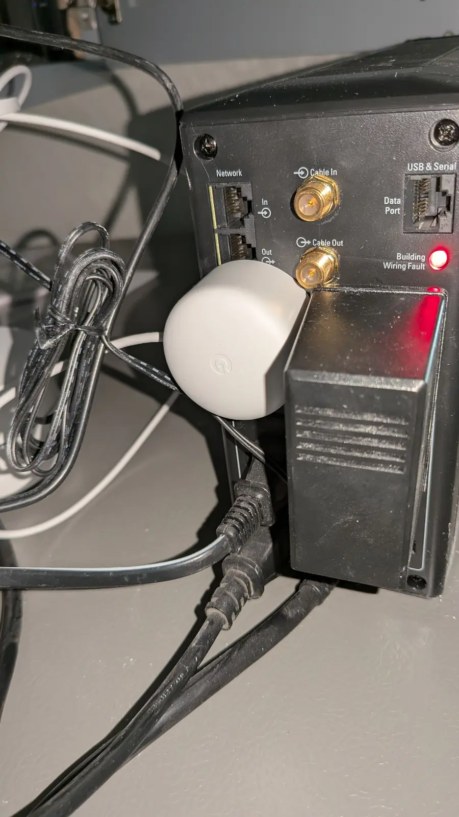 Network gateway with an attached puck antenna and power supply